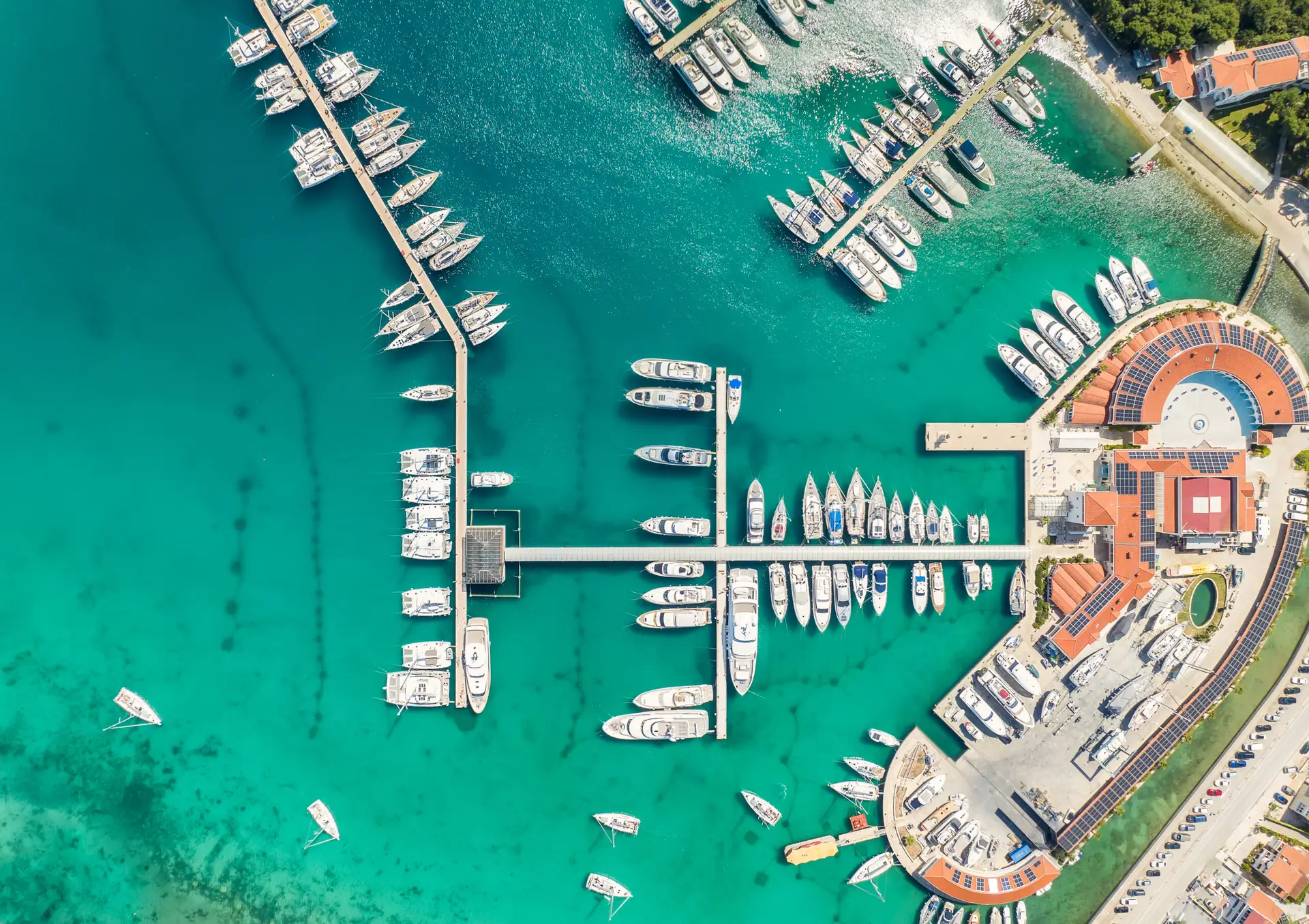 A modern gatehouse at a prestigious Florida Yacht Club, representing enhanced visitor and marina access management.