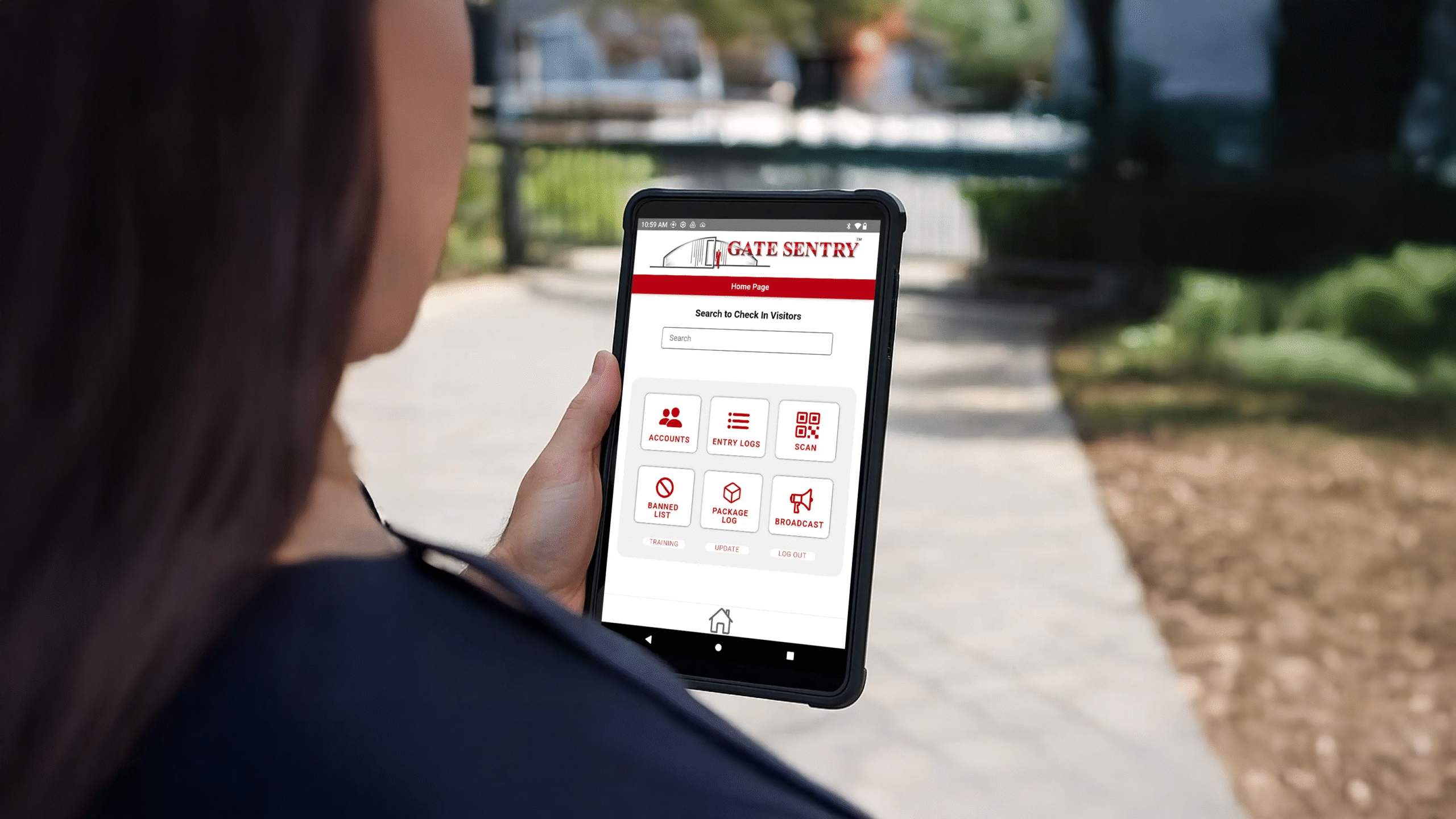 Security guard using Gate Sentry tablet for visitor access