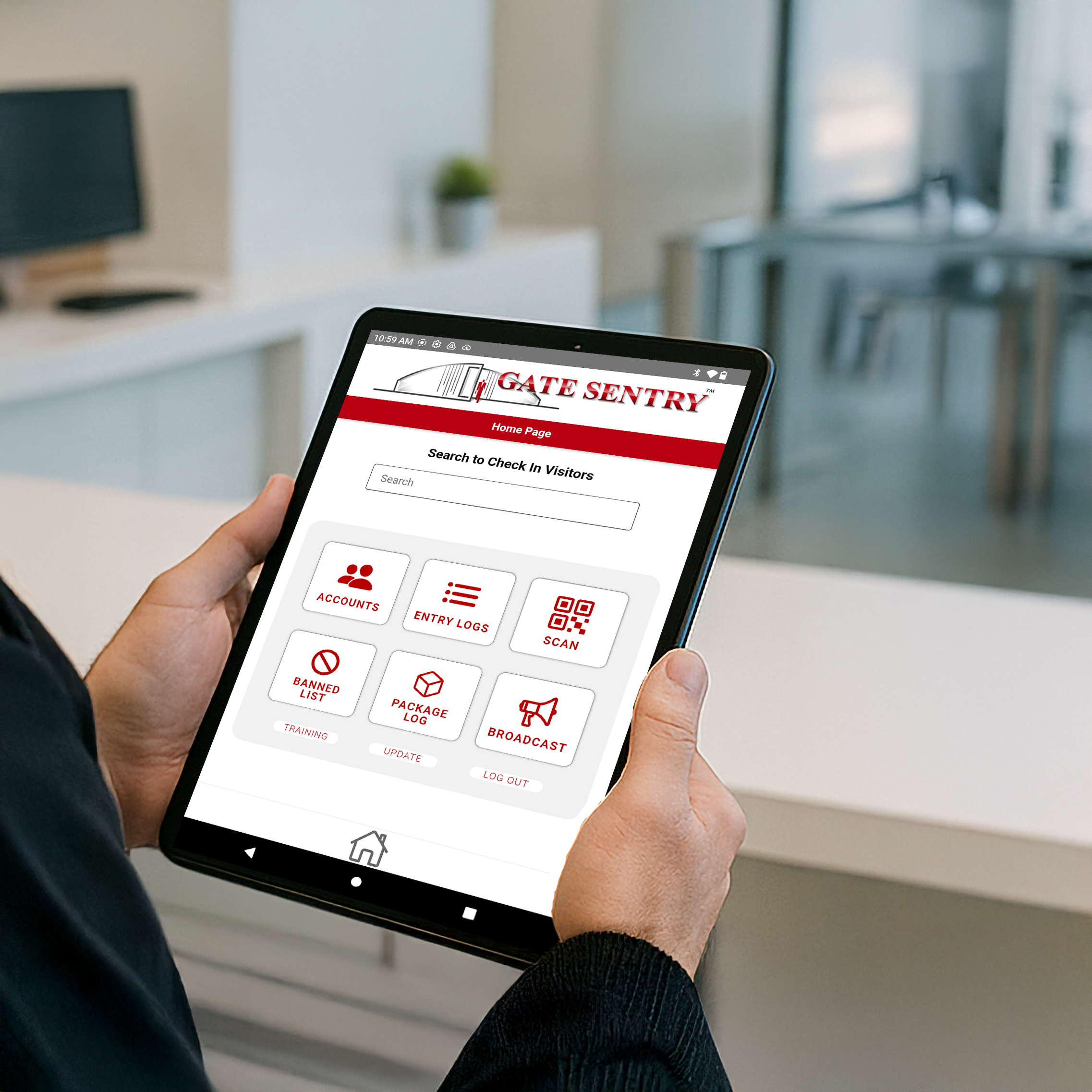Security guard operating a tablet for visitor management at a gate